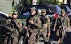 Soldiers arrive in Soyapango, El Salvador, Saturday, Dec. 3, 2022. 