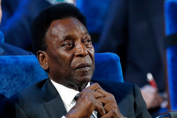 Pele attends the 2018 soccer World Cup draw at the Kremlin in Moscow, Dec. 1, 2017. The Brazilian soccer great is responding well to treatment for a r