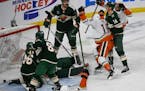 Anaheim winger Troy Terry (19) celebrated after scoring past Wild goalie Filip Gustavsson and other Minnesota defenders during the third period Saturd