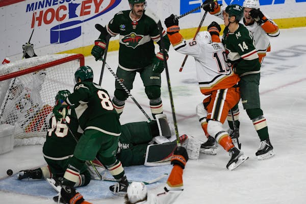 Anaheim winger Troy Terry (19) celebrated after scoring past Wild goalie Filip Gustavsson and other Minnesota defenders during the third period Saturd