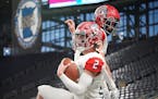 Elk River’s Cade Osterman (2) celebrates with Caleb Sandstrom (8) after scoring a touchdown in the first half of the Class 5A Prep Bowl.