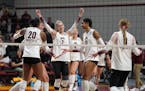 University of Minnesota's Jenna Wenaas (2) celebrates with Taylor Landfair (12) and fellow teammates after a 3-0 victory over UNI  to advance to the s