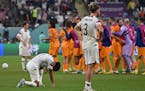 USA’s midfielder Tyler Adams (4), left, and USA’s defender Walker Zimmerman (3) reacts after they lost the Qatar 2022 World Cup round of 16 footba