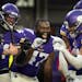 Vikings safety Camryn Bynum, right, celebrated his game-clinching interception in the fourth quarter with linebacker William Kwenkeu (47) and other te