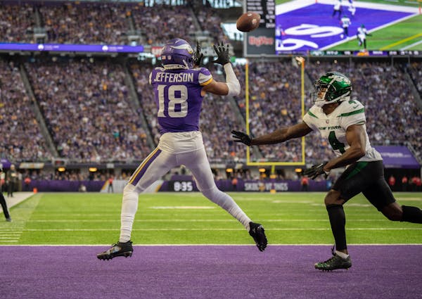 Vikings receiver Justin Jefferson scored a fourth-quarter touchdown against Jets cornerback D.J. Reed.