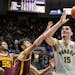 Purdue center Zach Edey shoots during the second half against the Gophers on Sunday