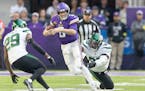 Vikings quarterback Kirk Cousins showed his toughness on the run and in the pocket Sunday against the Jets. 