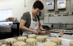 Pauline Kwan making mooncakes Mid-Autumn Festival in 2018 inside the kitchen at the iconic Keefer Court. The bakery has announced it will close at the
