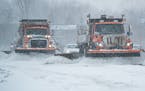 A trio of snowplows cleared ramps along I-35, Feb. 22, 2022, in Lakeville.