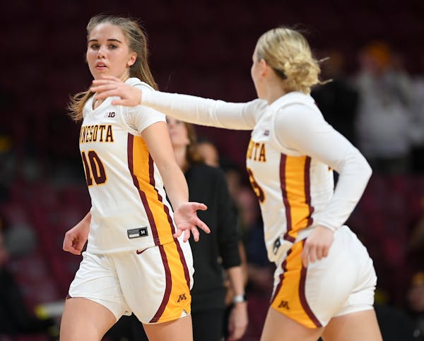 Gophers guard Mara Braun, left, and Katie Borowicz  celebrated a three pointer from Braun against Wake Forest last Wednesday at Williams Arena.