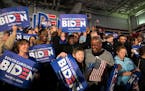 Supporters of former Vice President Joe Biden respond to early returns from the South Carolina Democratic Primary, in Columbia, S.C., Feb. 29, 2020. (