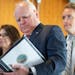 Gov. Tim Walz reviewed notes before speaking about Minnesota’s budget and economic forecast Tuesday at the Minnesota Department of Revenue in St. Pa