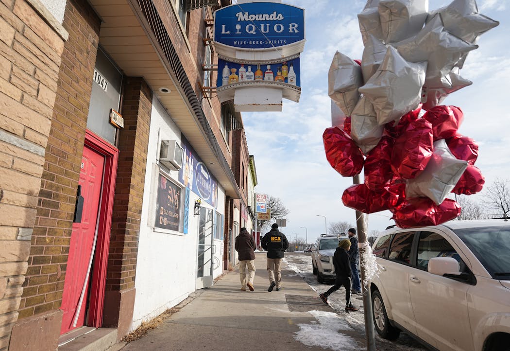 BCA investigators examined the site outside Mounds Liquor where Howard Johnson was shot by St. Paul police Monday evening. Johnson allegedly displayed a gun as officers moved in to make an arrest, police said.