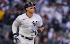 New York Yankees’ Aaron Judge watches his solo home run ball during the second inning of Game 5 of an American League Division baseball series again