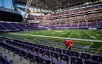 Nicole Powers mopped the floors at the 50-yard line seats on Wednesday at U.S. Bank Stadium in Minneapolis. She was part of a crew deep-cleaning the s