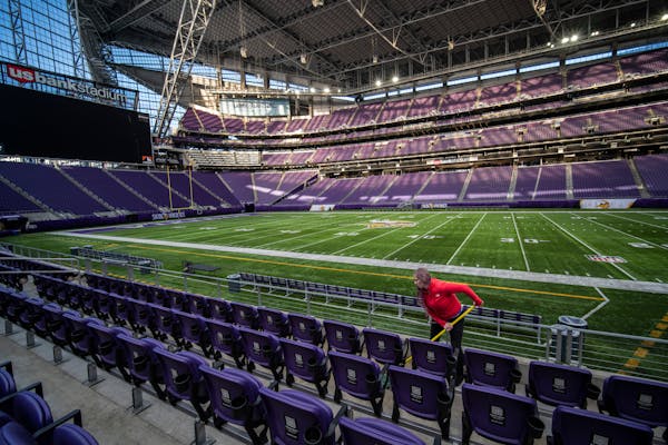 Nicole Powers mopped the floors at the 50-yard-line seats on Wednesday at U.S. Bank Stadium in Minneapolis. She was part of a crew deep-cleaning the s