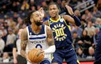 Timberwolves guard D’Angelo Russell shot against Pacers guard Bennedict Mathurin in the second quarter at Target Center on Wednesday. Russell scored