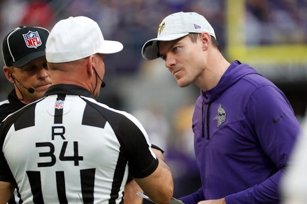 Minnesota Vikings head coach Kevin O’Connell, right, talks with referee Clete Blakeman, left, during Sunday’s game against the Jets.