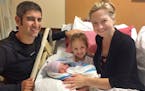 This Aug. 9 2018 photo provided by Amy Bianchi of Albany, N.Y. shows her with her newborn son, Brayden, with his father, Christopher, and sister, Mia,