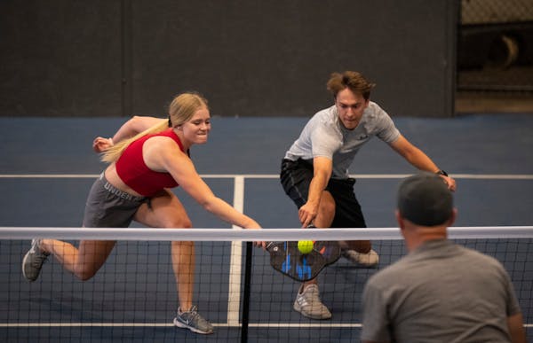 Cora Stallcup and Noah Wolfe both went for a return while taking part in a pickleball league game at the Minneapolis Cider Co. in 2021.