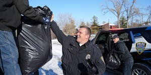 New Hope Police Chief Tim Hoyt helped load donated coats at the Salvation Army coat drive Thursday at Mounds View Community Center. 