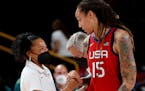 Brittney Griner, right, talked to Olympic coach Dawn Staley during the Toyko Games in 2020.