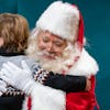 Allan Siu, dressed as Santa Claus, gave a hug to Andrew Baechler, 5, Thursday, Dec. 8, 2022 at The Santa Experience in the Mall of America in Blooming