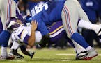 Quarterback Josh Freeman was hit by defensive tackle Shaun Rogers shortly after throwing the ball in the fourth quarter. The Vikings lost 23-7. ] Minn