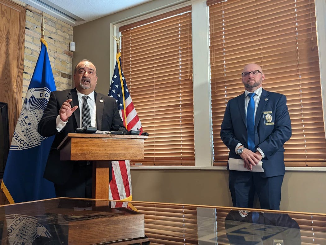 Peace Officers Association consultant Imran Ali, left, and St. Paul Police Federation President Mark Ross and Minnesota Police spoke at a news conference Dec. 9.