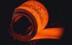 A heated and stretched steel slab is coiled at the NLMK Pennsylvania plant in Farrell, Pennsylvania, on Sept. 19, 2019.