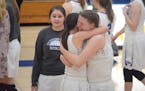 Monika Czinano (right) hugged sister Maggie Czinano after their last game on a court together — Watertown-Mayer’s section final loss in 2018.
