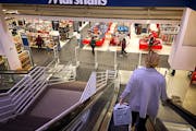 Shoppers at the downtown Marshalls store Friday. Separately, Ameriprise Financial said it will exit the skyscraper that has been its headquarters and 