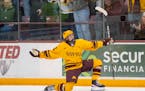 Minnesota forward Logan Cooley (92) celebrates scoring a goal against Wisconsin in the first period.