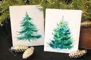 This image provided by Judy A. Steiner shows handmade watercolor Christmas tree cards. Handmade holiday cards can be gifts in themselves for both make