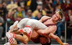 Gophers wrestler Patrick McKee (above, right) has outscored opponents 122-25 this season.
