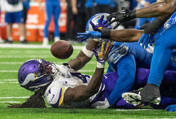 Minnesota Vikings running back Dalvin Cook (4) fumbled the ball late in the second quarter and the Lions recover In Detroit on Sunday.