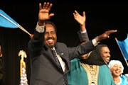 Somali President Hassan Sheikh Mohamud waved at a crowds of hundreds at the Minneapolis Convention Center in 2012. He returns this week for the first 