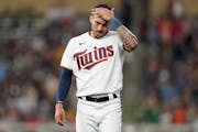 Minnesota Twins' Carlos Correa reacts after the bottom of the fifth inning of a baseball game against the San Francisco Giants, Saturday, Aug. 27, 202