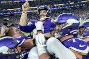 Vikings kicker Greg Joseph celebrates with teammates after kicking the game-winner in overtime Saturday at US Bank Stadium, completing a historic come