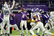 Vikings quarterback Kirk Cousins threw under pressure in overtime against the Colts on Saturday.