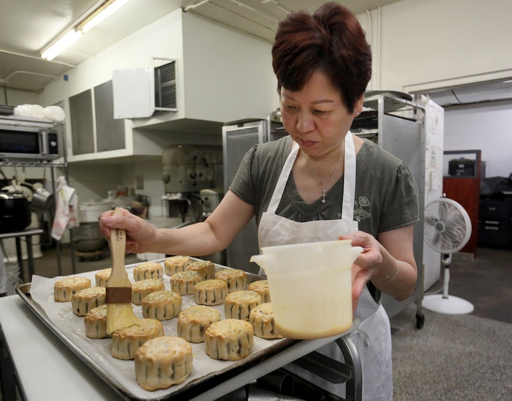 Paulina Kwan made mooncakes ahead of the Mid-Autumn Festival in 2018 by brushing an egg wash on once-baked mooncakes before putting them back in the oven for finishing.