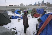 Mase Jackson, who has lived in a tent in the shadow of downtown for three weeks, said people were using buckets to go to the bathroom until the city i