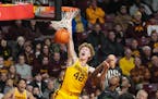 Gophers sophomore Treyton Thompson (42) slammed a missed shot to seal the 58-55 win against Chicago State at Williams Arena on Thursday.