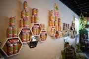 Non-alcoholic THC seltzers are featured in a display on a wall in Natreum in St. Louis Park. The Natreum sells newly legal hemp-derived products as we