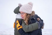 Nancy Musser embraces her daughter-in-law, Julia Musser, as they search for Nancy’s son, George Musser, Sunday, Dec. 25, 2022 in Stillwater, Minn. G