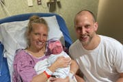 Isabelle Alice Koopman, pictured with parents Ashley and Cameron Koopman, was born at midnight as the new year began.