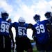 Players huddle up before running a play during a Minneapolis North football practice Tuesday, Sept. 20, 2022 at the North High Athletic Field in Minne