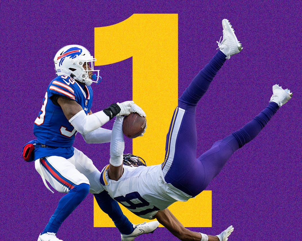 Vikings wide receiver Justin Jefferson made an acrobatic catch on fourth and long in the fourth quarter against Bills cornerback Cam Lewis. Photo by Jerry Holt, Star Tribune.