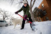 Alicia Gibson shoveled a sidewalk in the Wedge neighborhood of Minneapolis in 2018.
