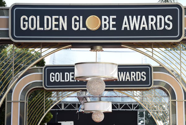 FILE - Event signage appears above the red carpet at the 77th annual Golden Globe Awards on Jan. 5, 2020, in Beverly Hills, Calif. The 80th annual Gol